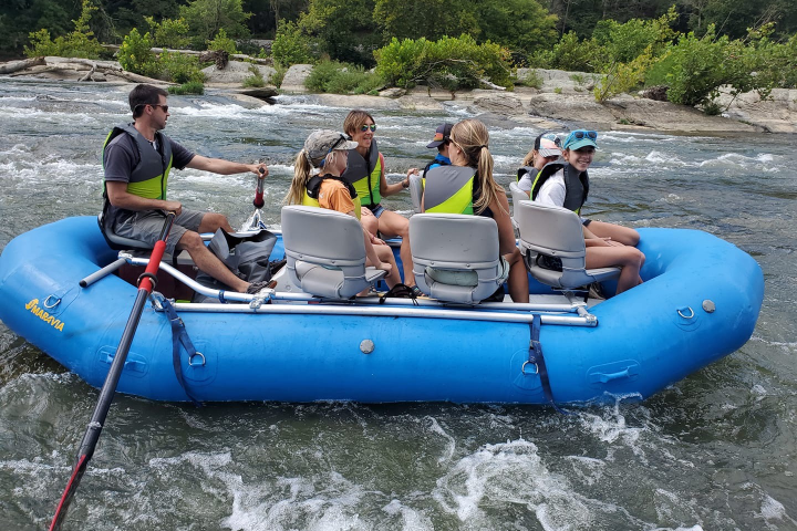 a group of people riding on the back of a boat